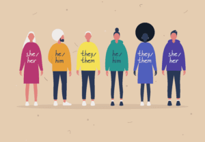 Group of people with Pronouns on their shirts